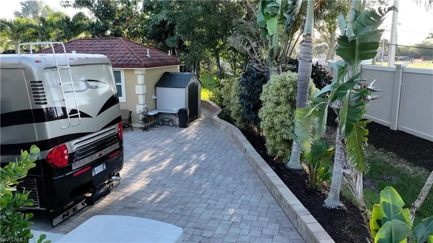 View of parking featuring a shed
