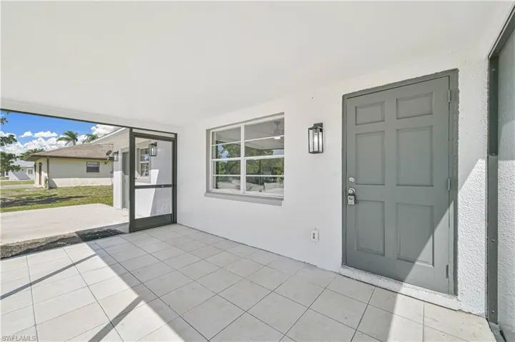 Entry for the main house with large screen in porch