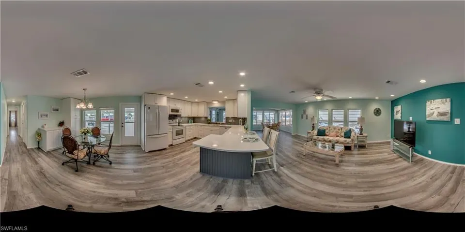 Living area featuring light wood-type flooring, ceiling fan, a chandelier, healthy amount of natural light, and recessed lighting