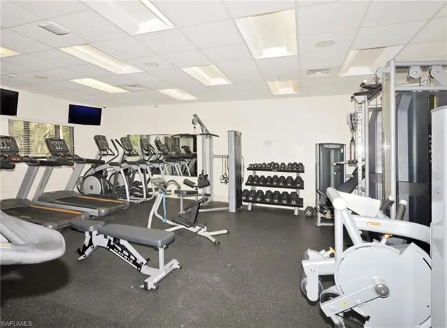Workout area with a paneled ceiling