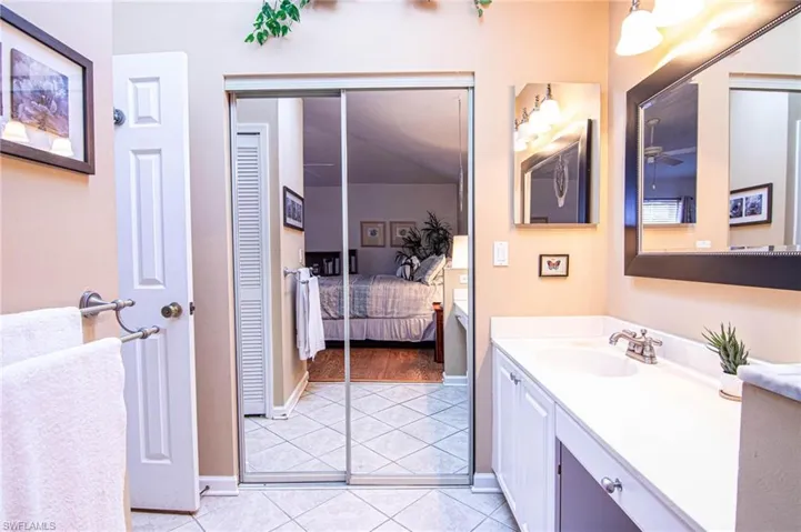 Bathroom with tile patterned flooring and vanity