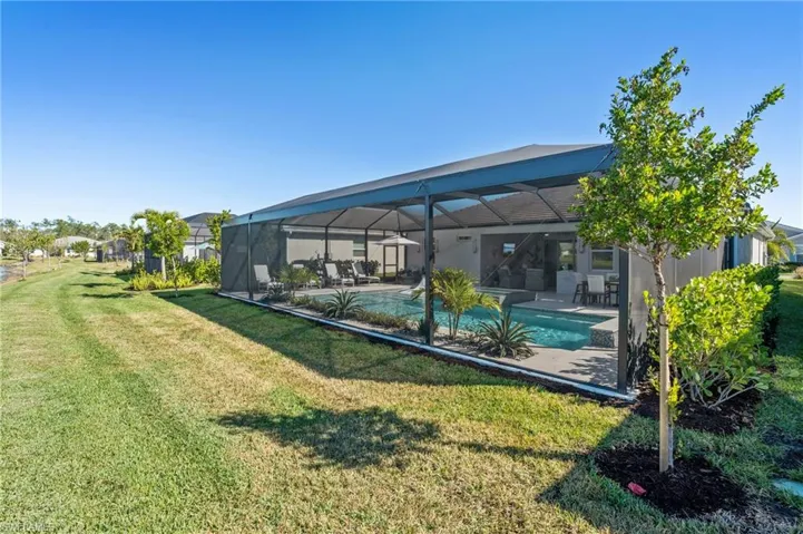 View of yard with a patio area and a lanai