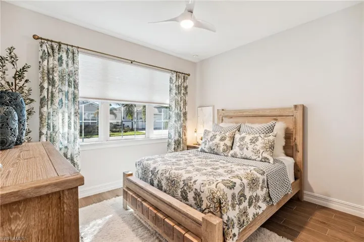 Bedroom featuring hardwood / wood-style flooring and ceiling fan