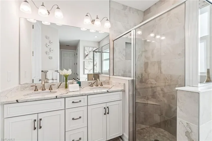 Bathroom featuring vanity and walk in shower
