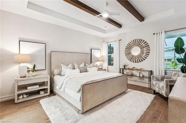 Bedroom with hardwood / wood-style floors, ceiling fan, and beam ceiling
