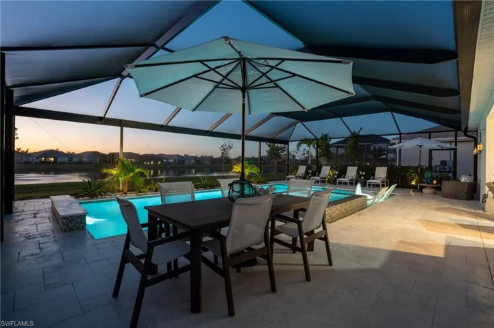 Patio terrace at dusk with a lanai