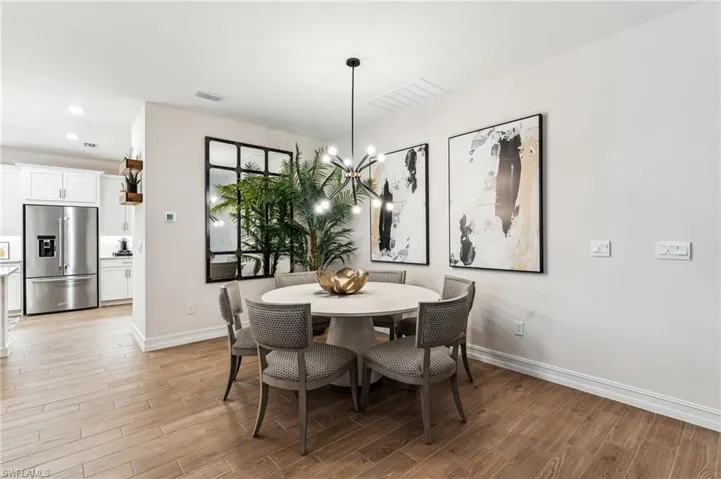Dining room featuring a chandelier and light hardwood / wood-style floors