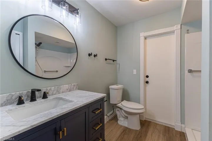Bathroom featuring light wood-type flooring and vanity