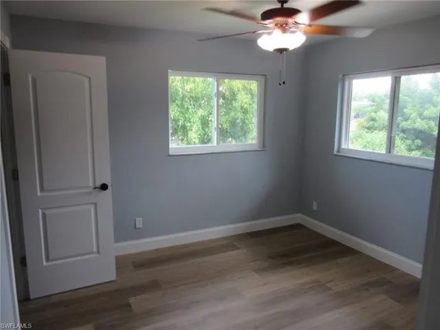 Spare room with ceiling fan and light wood finished floors