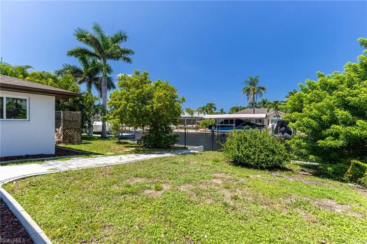 View of green lawn with a water view