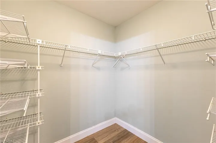 Spacious closet with light wood-type flooring