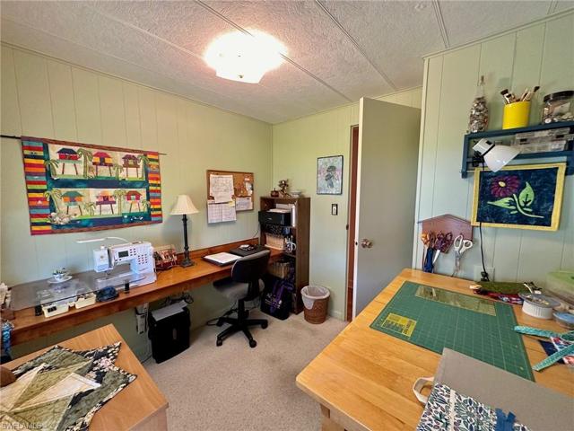 Second bedroom currently used as a craft room.