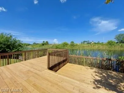 Wooden terrace featuring a water view
