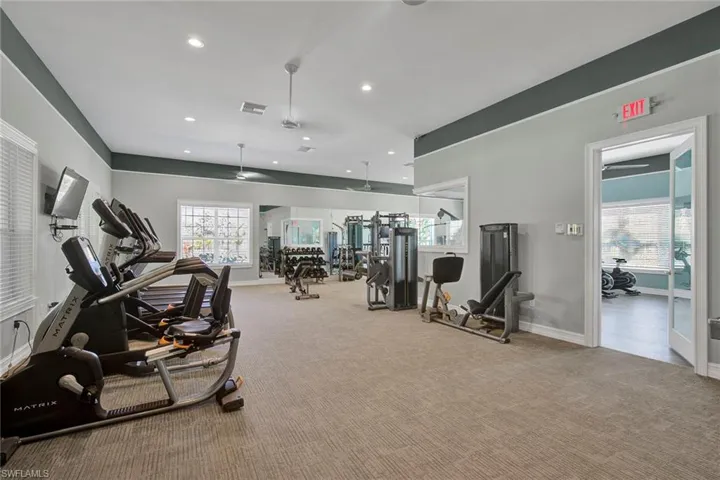 Exercise room featuring recessed lighting