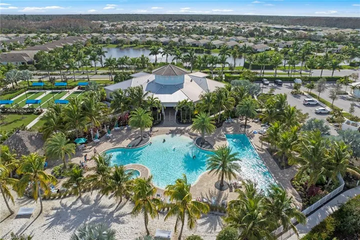 Community pool with a residential view
