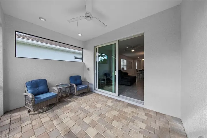 View of patio featuring a ceiling fan