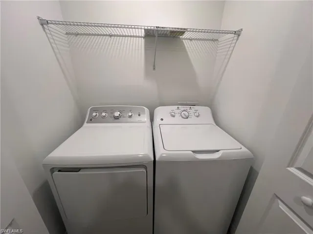 Laundry area featuring separate washer and dryer