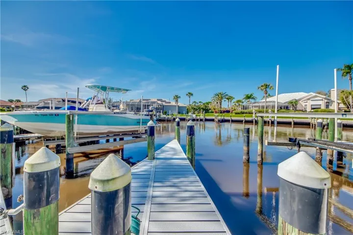 Dock area featuring a water view and boat lift