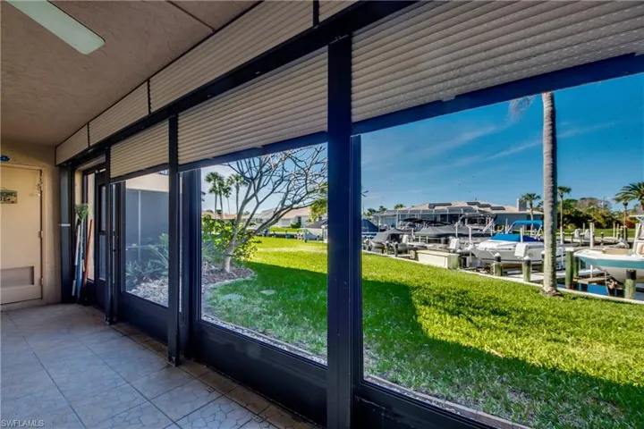 Unfurnished sunroom with a water view