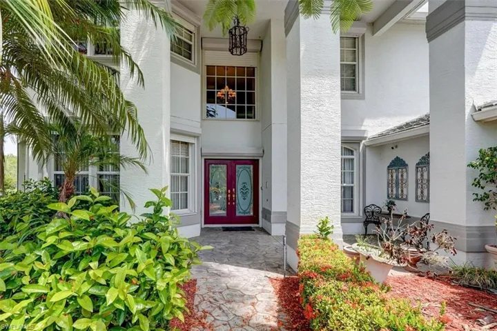 Property entrance featuring french doors