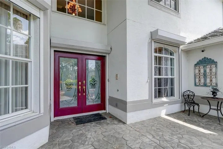 View of exterior entry featuring french doors