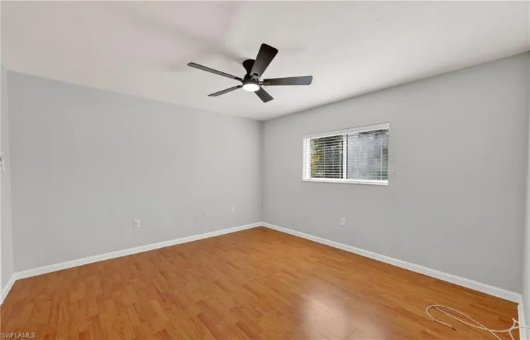Unfurnished room featuring light wood finished floors and ceiling fan