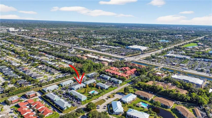 Aerial view of property's location with nearby suburban area