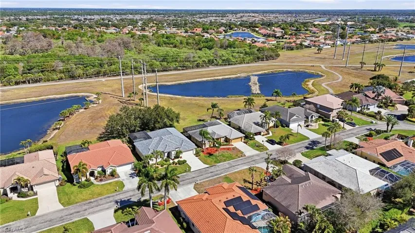 Aerial perspective of suburban area with a nearby body of water