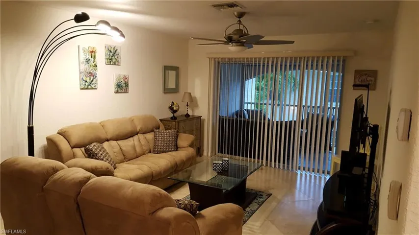 Tiled living room with ceiling fan