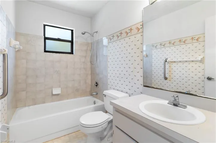 Full bath featuring vanity and shower / bathtub combination