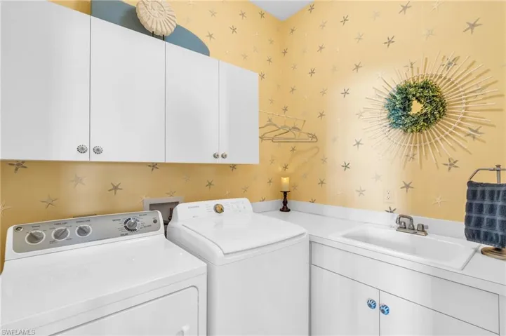 Laundry room cabinet space, and washing machine and dryer