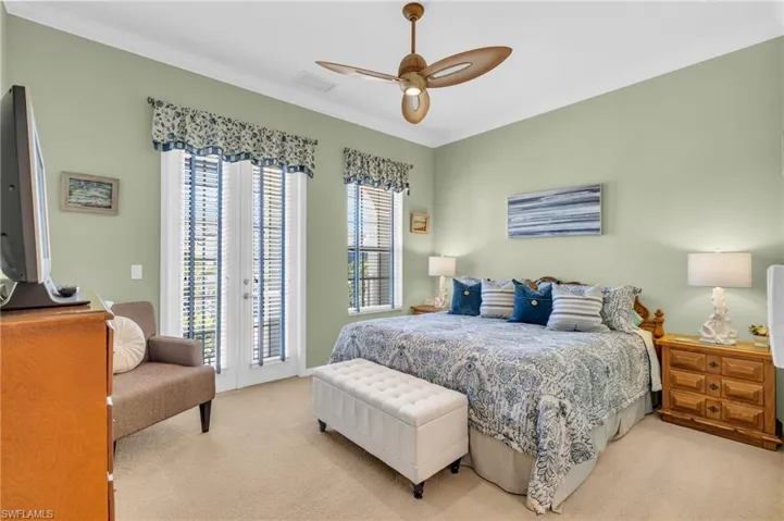 Bedroom with access to exterior, ornamental molding, carpet, and ceiling fan
