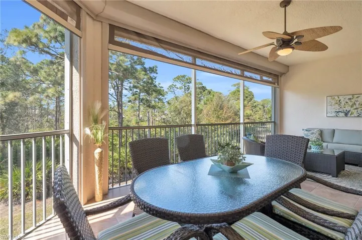Sunroom / solarium with view of scattered trees