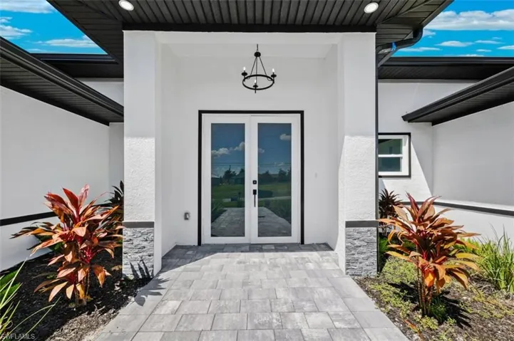 Doorway to property featuring french doors