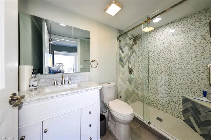 OWNER'S SUITE WITH ADJUSTABLE TWIN BEDS.  DOOR LEADS TO WALK-IN CLOSET.