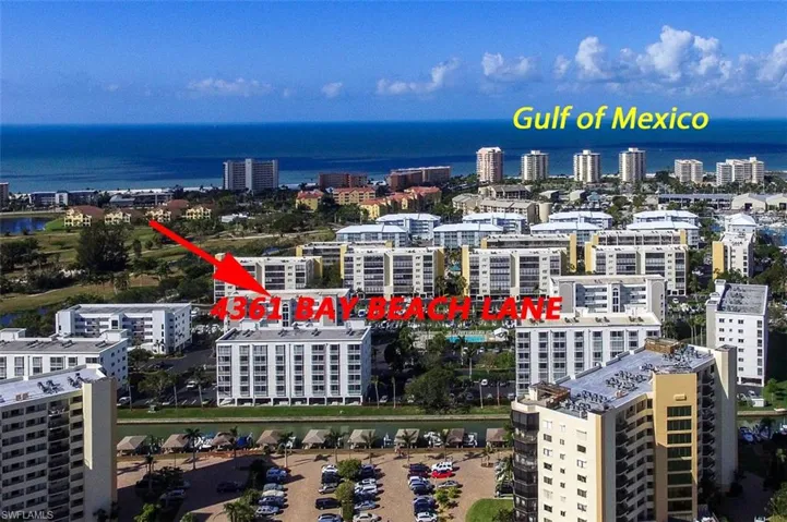 AERIAL VIEW.  ON THE LEFT SIDE OF THE PHOTO IS WHERE THE BAY BEACH COMMONS AMENITIES ARE.  AMENITIES THERE INCLUDE PICKLEBALL, TENNIS AND BOCCE BALL COURTS AS WELL AS PATHS. CASA MARINA HAS DEEDED BEACH ACCESS, JUST DOWN THE STREET FROM THE COMMUNITY.