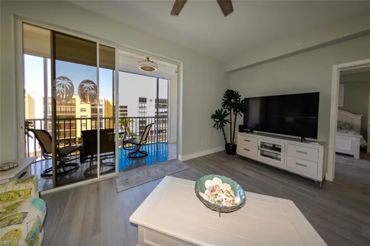 LIVING AREA SHOWING ENTRANCE TO LANAI AND ENTRANCE TO OWNER'S SUITE.