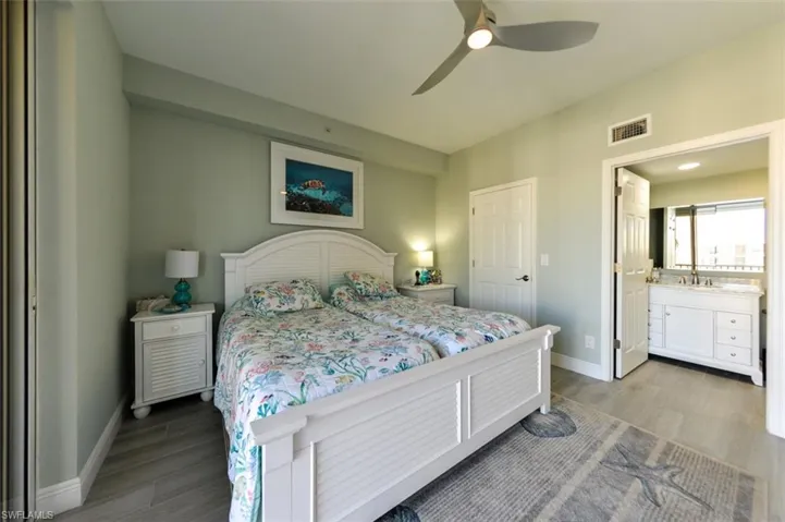 OWNER'S SUITE WITH ADJUSTABLE TWIN BEDS.  DOOR LEADS TO WALK-IN CLOSET.