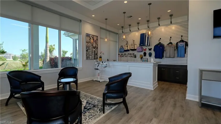 Sitting room with hardwood / wood-style flooring
