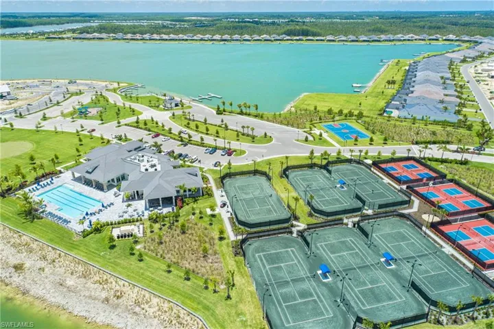 Birds eye view of property with a water view