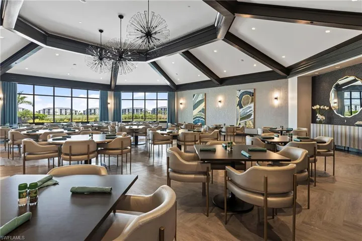 Lobby with wallpapered walls, beamed ceiling, and recessed lighting