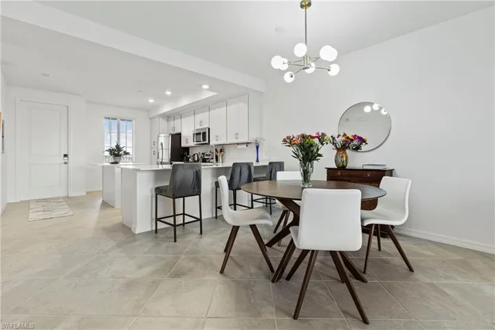 Dining area with a chandelier and recessed lighting