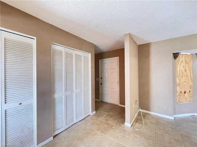 Entry door. There is lots of storage here. These are all closets for storage then you have another closet tucked in from this view you would go to the door and turn left.
