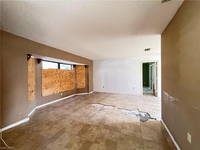 Large living room with big windows for lots of light.