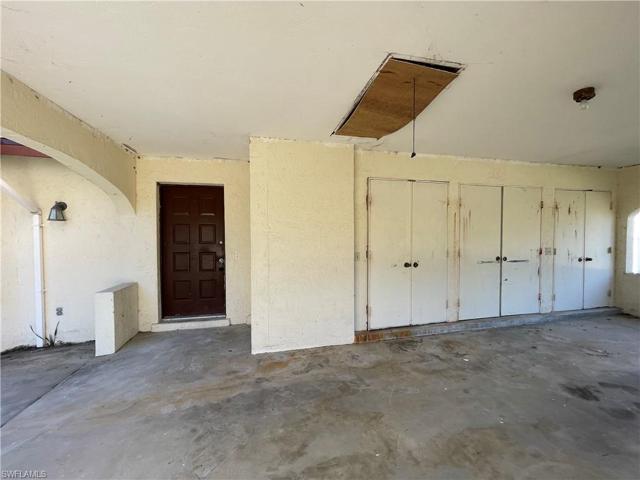 In the doors you will find the water heater, utility sink, washer, dryer and room for storage. Bonus, the entry door is covered by carport.