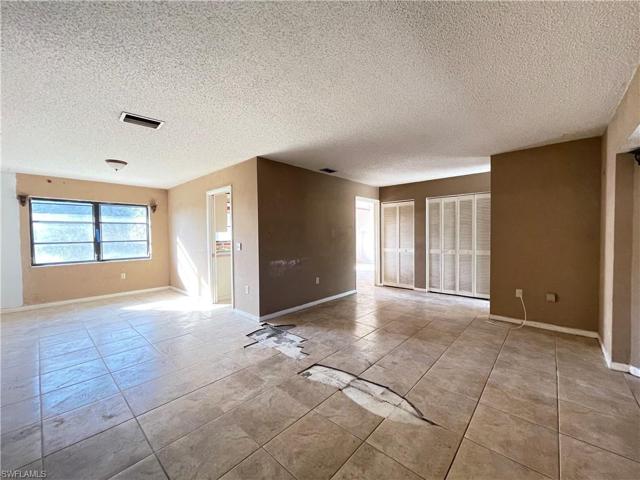 From the end of the living room view with the dining to the left and the entry to the right.