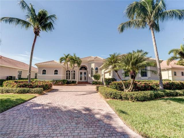 Long paver stone driveway on this elegant estate home