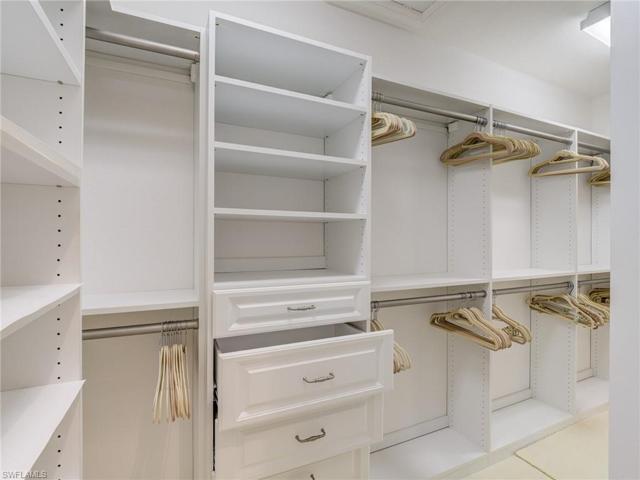 Walk-in closet with custom cabinetry