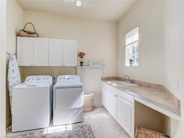 Laundry room between garage and guest bedroom hallway
