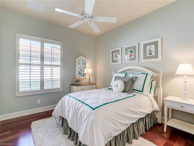 Guest bedroom 1 with wood flooring